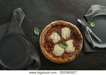 Pizza Margherita Served With Mozzarella Cheese, Tomato Sauce And Fresh Basil