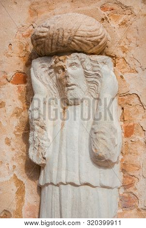 Moorish Merchant With Turban Ancient Medieval Statue Located In Campo Dei Mori (moors Square) In The