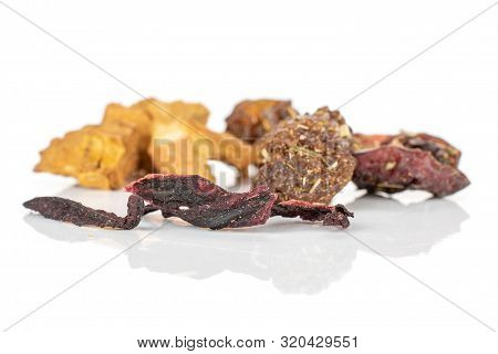 Group Of Nine Pieces Of Raisins Roseship Hibiscus Of Lingonberry Strawberry Fruit Tea Macro Isolated