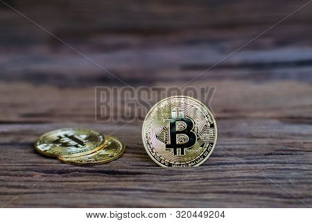 Digital Currency Physical Metal Bitcoin Coin On The Old Wooden Table