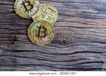 Digital Currency Physical Metal Bitcoin Coin On The Old Wooden Table