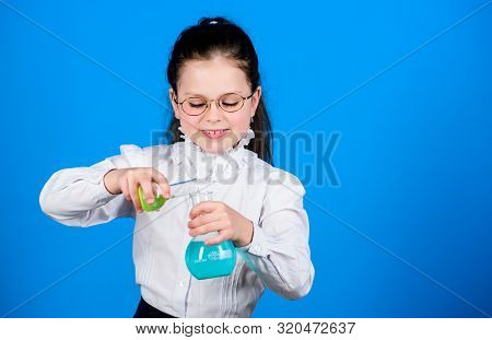 Small Smart Girl With Testing Flask. Child Study Bilogy Lesson. Science Research In Lab. Small Schoo