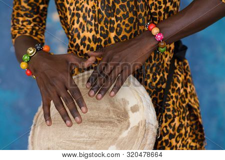 African Male Hands Playing On Jembe Drum, Closeup
