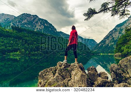 Landscape With Woman On Sunbed Next To The Lake Leopoldsteinersee, Styria, Austria. Travel Destinati