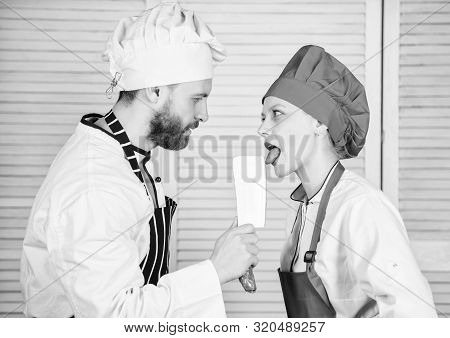 Chef Hold Cleaver Knife Tool While Woman Lick Blade. Cooking Is Sexy. Sharp Knife Professional Tool.