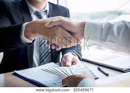 Dishonest Cheating In Business Illegal Money, Businessman Handshake With Money Of Dollar Banknotes I
