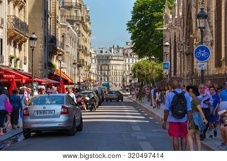 Paris, France - June 23, 2017: Tourists Walking On The Historic Rue Du Cloitre-notre-dame Street Nex