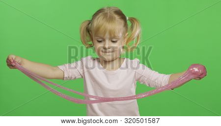 Child Having Fun Making Ping Slime. Kid Playing With Hand Made Toy Slime. Funny Kid Girl. Relax And 