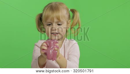 Child Having Fun Making Ping Slime. Kid Playing With Hand Made Toy Slime. Funny Kid Girl. Relax And 