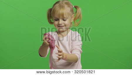Child Having Fun Making Ping Slime. Kid Playing With Hand Made Toy Slime. Funny Kid Girl. Relax And 