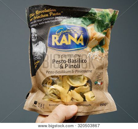 Paris, France - Aug 21, 2019: Man Hand Holding Delicious Giovanni Rana Tortelloni With Pesto-basilic