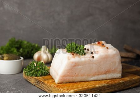 Composition With Pork Fatback On Grey Stone Table. Space For Text