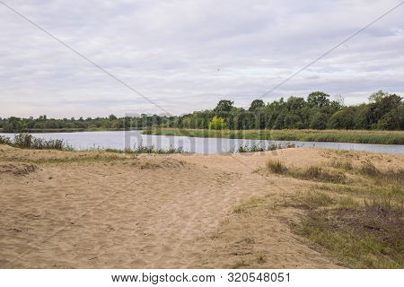 City Carnikava, Latvian Republic. Green Nature In Summer With River Gauja And Waves. Travel Photo. S