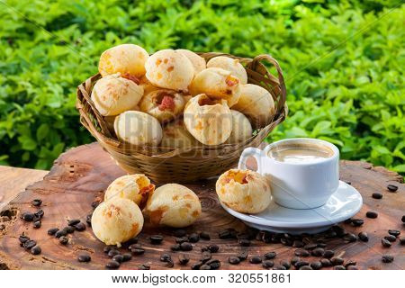Brazilian snack cheese bread, pao de queijo, Brazilian snack cheese bread stuffed with pepperoni and a cup of coffee