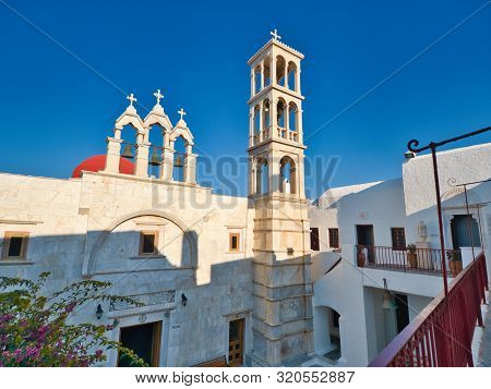 Ano Mera, Mykonos, Greece - July 23 2019 Low Angle Of Historic Stone Building Of Monastery Of Panagi