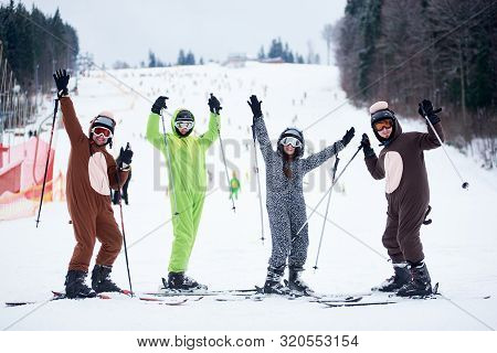 Bukovel, Ukraine - December 09, 2018: Skiers Men And Woman On Skis In Ski Mask Dressed In Animals Co