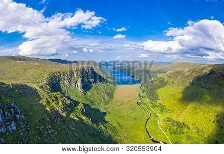 Aerial View Of The Glenveagh National Park With Castle Castle And Loch In The Background - County Do