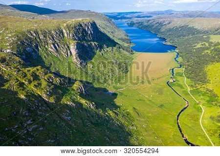 Aerial View Of The Glenveagh National Park With Castle Castle And Loch In The Background - County Do