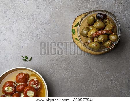 Italian Food Ingredients Background With Olives, Oil Red Stuffes With Cheese Bell Peppers
