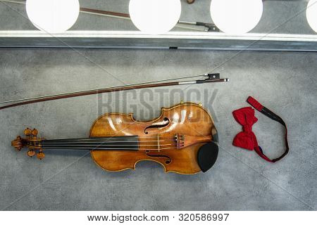 Brown Violin With Bow On The Grey Table, Classic Music