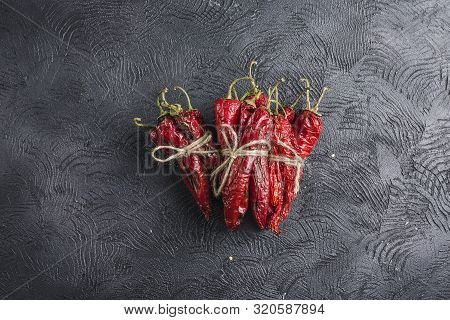 Spicy Chili On A Dark Background, Flatlay. Used As An Ingredient For Harissa, Ajika, Muhammara. East