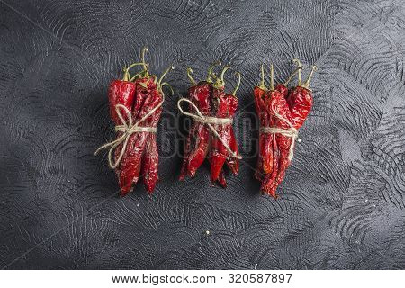 Spicy Chili On A Dark Background, Flatlay. Used As An Ingredient For Harissa, Ajika, Muhammara. East