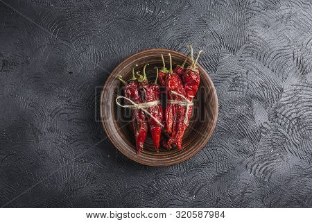 Spicy Chili On A Dark Background In Ceramic Plates, Flatlay. Used As An Ingredient For Harissa, Ajik