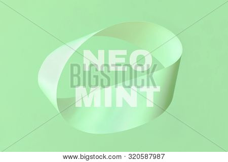 Mobius Strip Made From Paper Soaring In The Air On Mint Background. Trendy Surreal Airy Image. Abstr