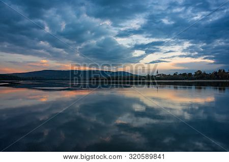 Amazing Sunrise View Over Danube River, Beautiful Reflections Of Morning Clouds Mirrored In Water, E