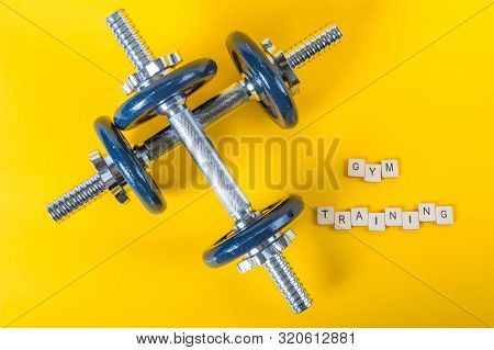Healthcare Concept Showing Dumbbells And The Message Gym Training