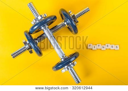 Healthcare Concept Showing Dumbbells And The Message Fitness