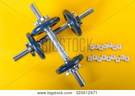 Healthcare Concept Showing Dumbbells And The Message Healthy Lifestyle