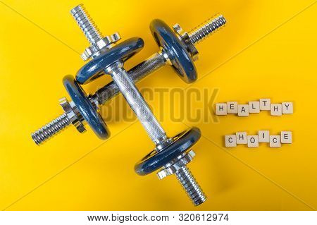 Healthcare Concept Showing Dumbbells And The Message Healthy Choice