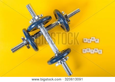 Healthcare Concept Showing Dumbbells And The Message Keep Going