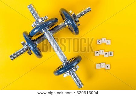 Healthcare Concept Showing Dumbbells And The Message One More Try