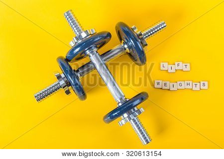 Healthcare Concept Showing Dumbbells And The Message Lift Weights