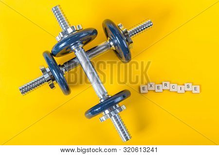 Healthcare Concept Showing Dumbbells And The Message Exercise