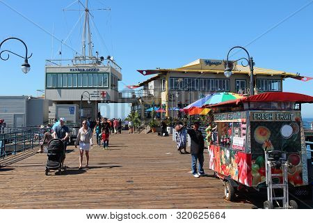 Santa Monica, United States - April 6, 2014: People Visit The Pier In Santa Monica, California. As O