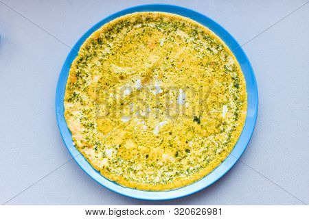 Fried Eggs And Seasoning. Amlet On A Round Plate. View From Above. Place For Writing