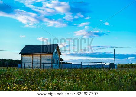The landscape with the image of meadow at sunset