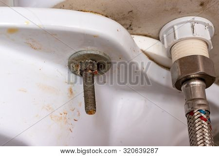 Water Supply Fitting Of Cistern Tank Of The Toilet Bowl At Water Closet Close Up