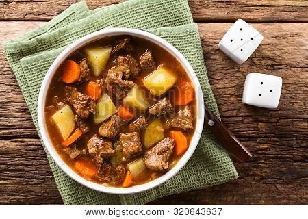 Fresh Homemade Beef Stew With Carrot And Potatoes Served In Bowl, Photographed Overhead