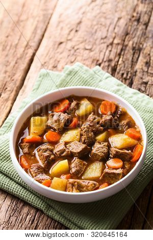 Fresh Homemade Beef Stew With Carrot And Potatoes Served In Bowl (selective Focus, Focus In The Midd