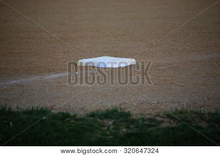 Baseball - Dusty Third Base During A Baseball Game.