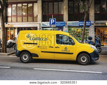 Barcelona, Spain - Nov 13, 2017: Yellow Correos Spanish Postal Van Parked On A Barcelona Street