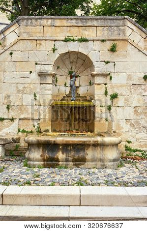 Roman Fountain Dripping Water At Barjac Gard Occitanie France