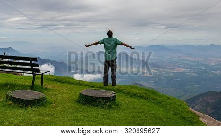 Man Isolated Soaking Natural Beauty From Hill Top Image Is Showing The Human Love Towards The Nature