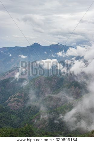 Layers Of Hill Below White Cloud Image Taken At Kodaikanal Tamilnadu India From Top Of The Hill.