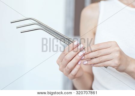 Girl Is Holding Stainless Steel Straws To Reduce The Amount Of Plastic Waste In The Environmen.