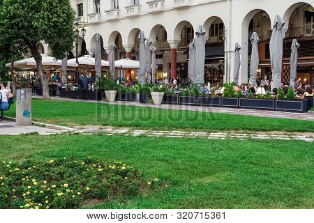 Thessaloniki, Greece - August 15 2019: People Enjoying Coffee At City Center Cafe Bars. Crowd Drinki